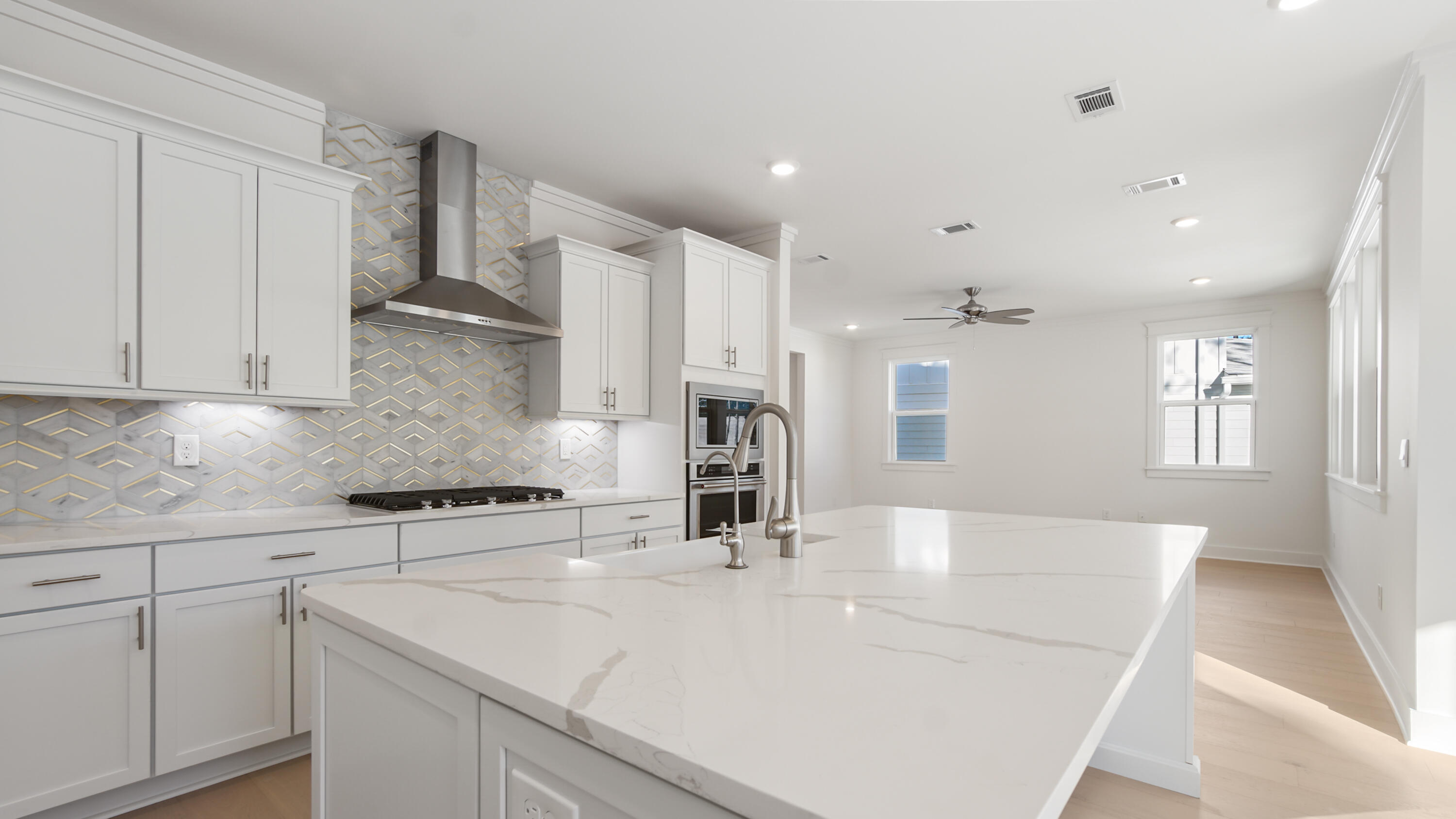 25 Ashwood Drive Santa Rosa Beach, FL 32459 - Photo 13 of 54 a kitchen with kitchen island a sink stainless steel appliances and cabinets