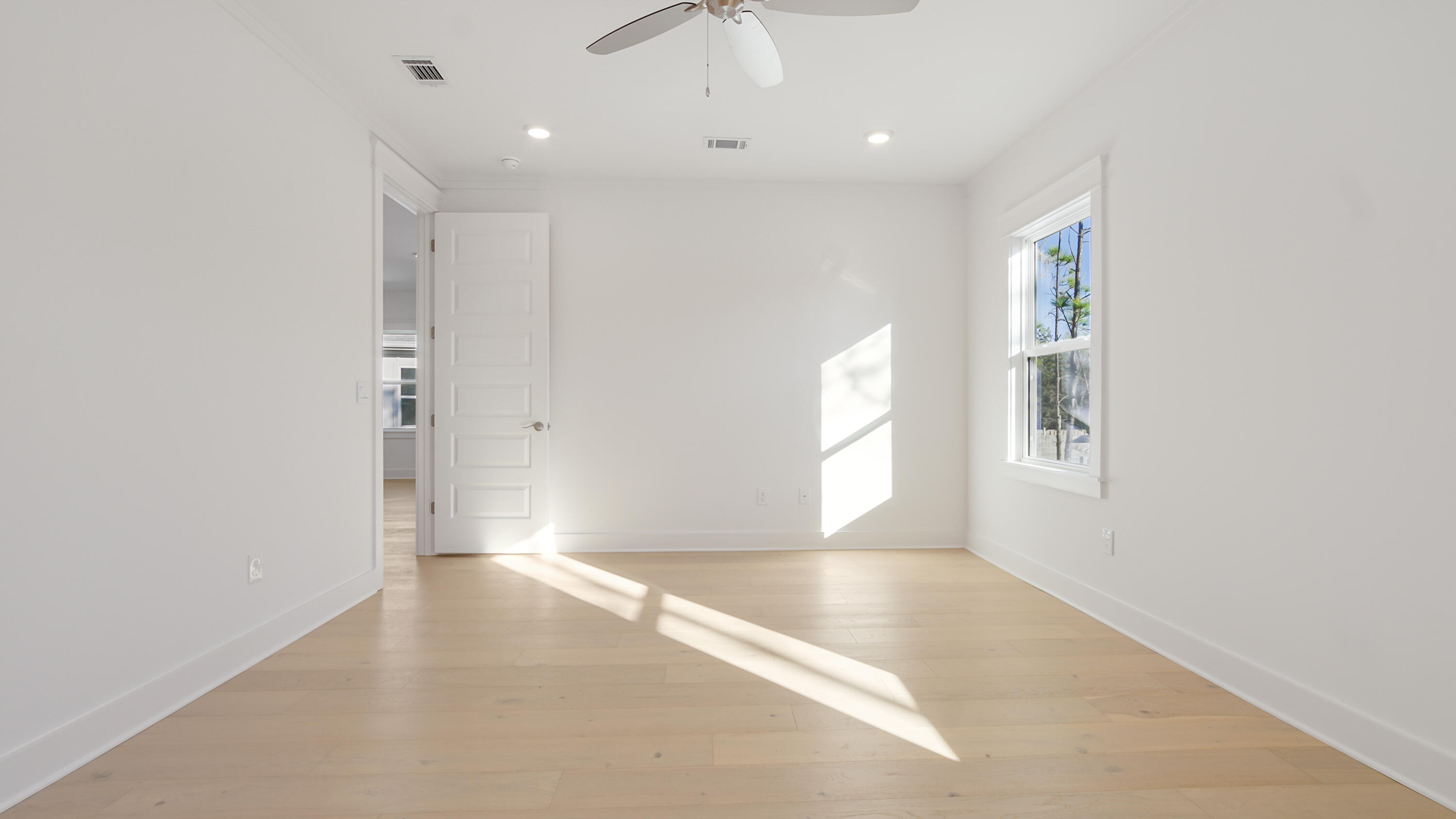25 Ashwood Drive Santa Rosa Beach, FL 32459 - Photo 37 of 54 wooden floor in an empty room with a window