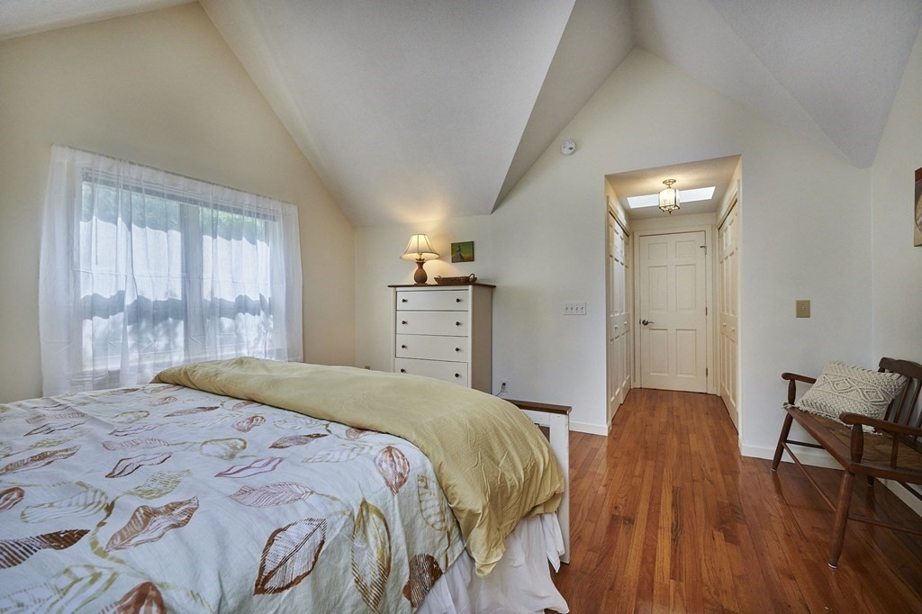 3 High Meadow Road Northampton, MA 01062 - Photo 25 of 40 a bedroom with a bed and wooden floor