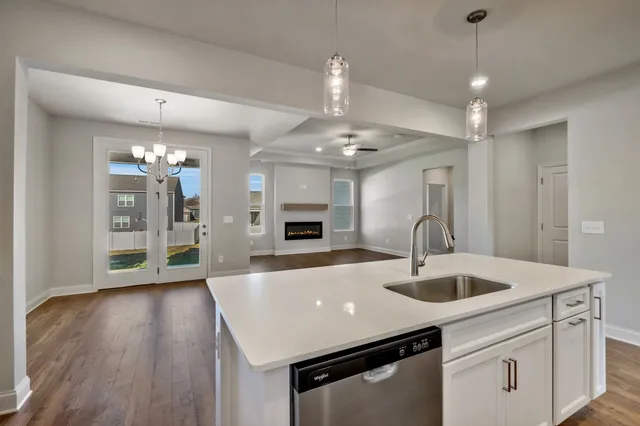 a bathroom with a bathtub toilet sink mirror and shower