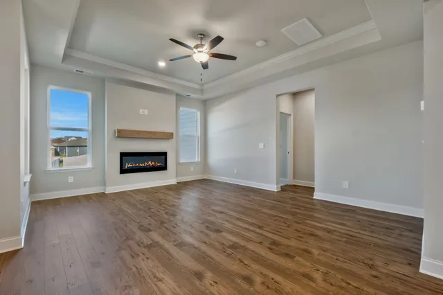 a view of a swimming pool and lounge chairs