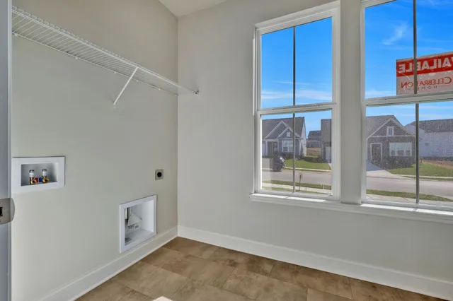 an empty room with fan and a ceiling fan