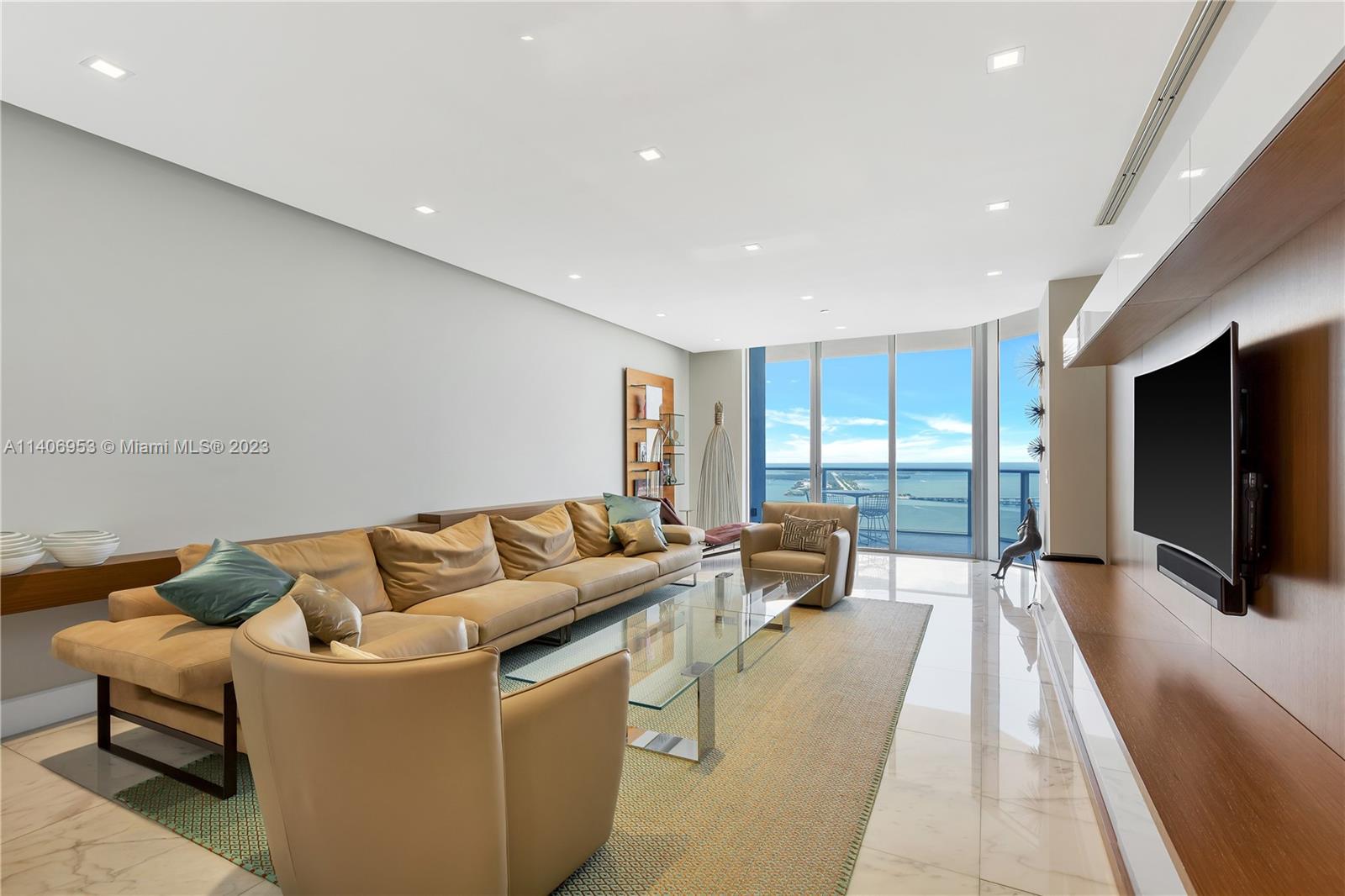 Brickell Miami, FL 33131 - Photo 1 of 41 a living room with furniture and a flat screen tv