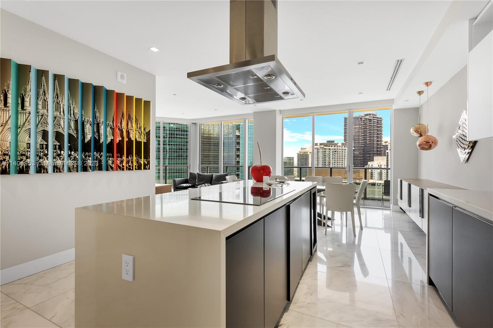 Brickell Miami, FL 33131 - Photo 12 of 41 a room with stainless steel appliances kitchen island a table and chairs in it