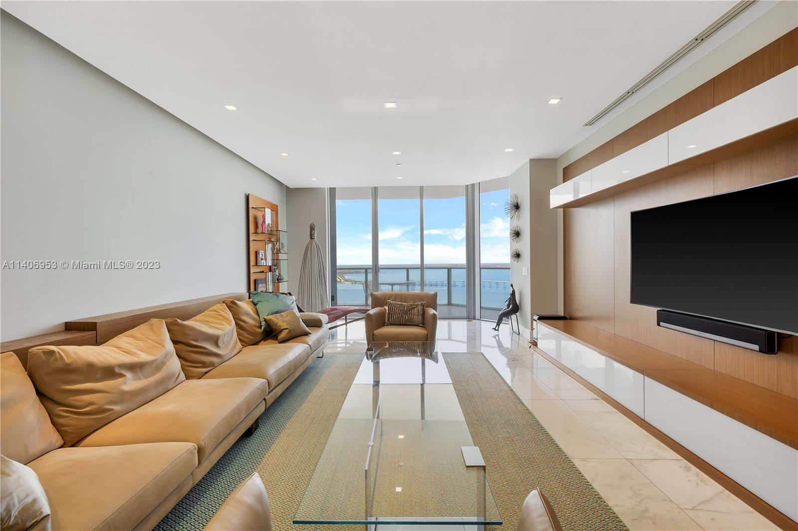 Brickell Miami, FL 33131 - Photo 2 of 41 a living room with furniture and a flat screen tv