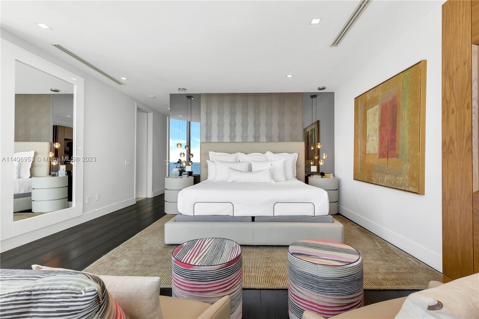 Brickell Miami, FL 33131 - Photo 22 of 41 a bedroom with a bed and wooden floor