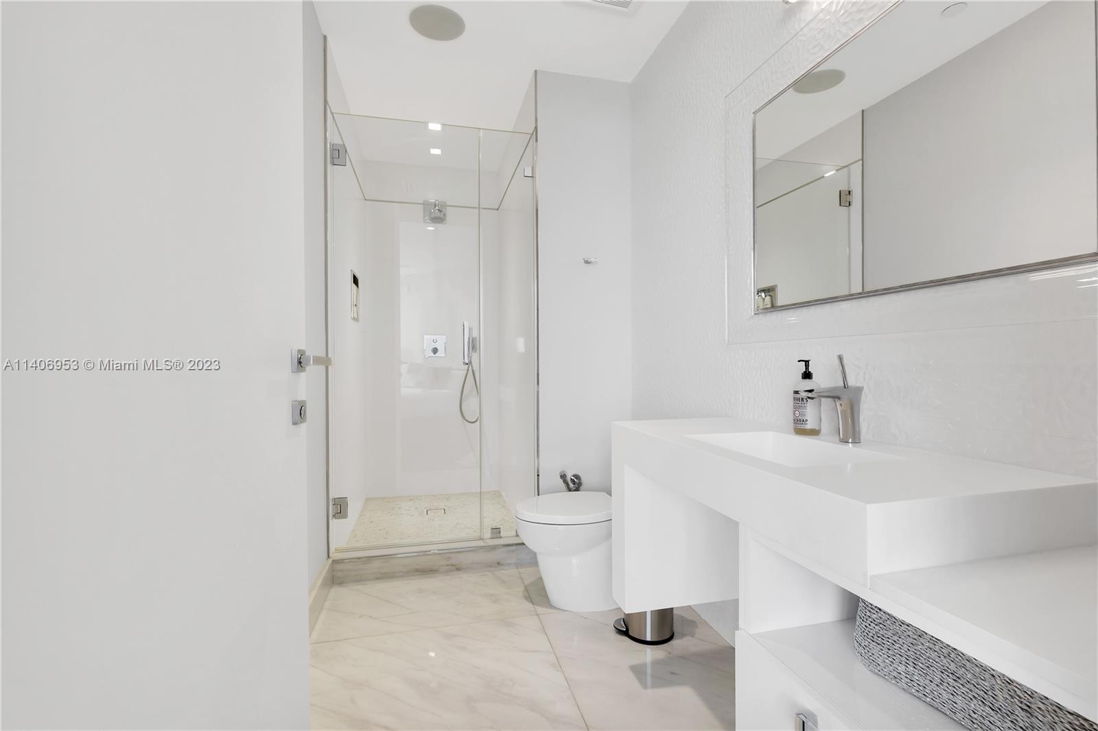 Brickell Miami, FL 33131 - Photo 29 of 41 a bathroom with a sink a toilet and shower