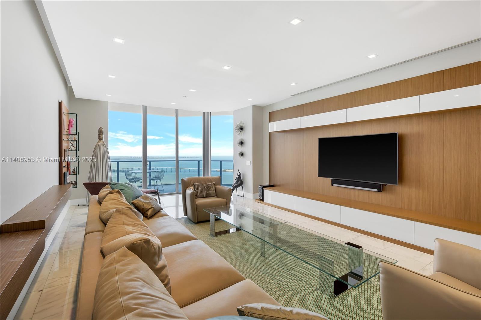 Brickell Miami, FL 33131 - Photo 3 of 41 a living room with furniture and a flat screen tv