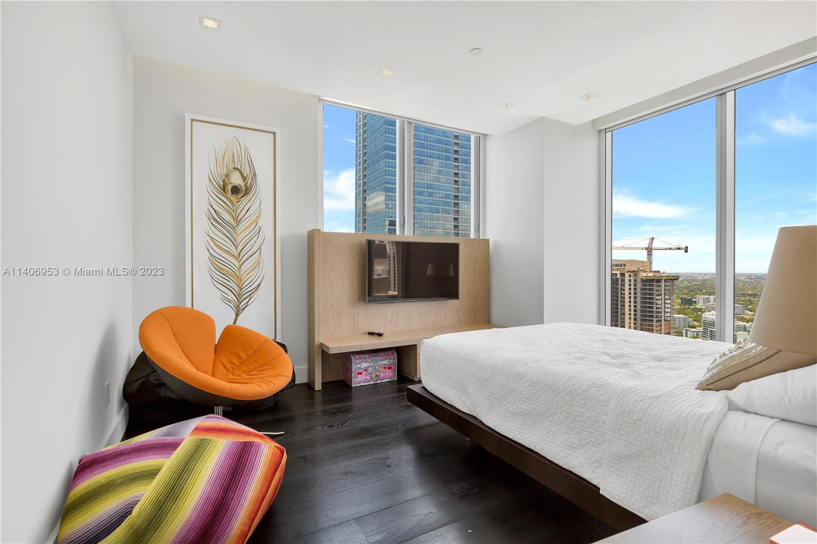 Brickell Miami, FL 33131 - Photo 31 of 41 a bedroom with a bed and wooden floor