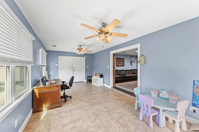a bedroom with furniture and a window