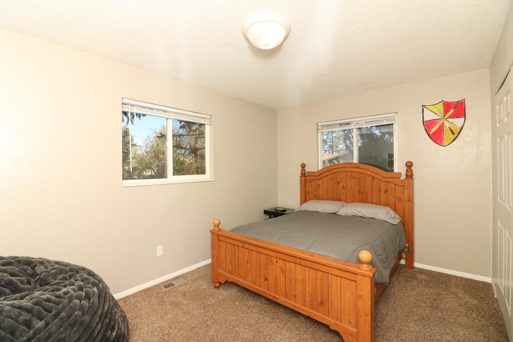 607-28 28 3/4 Road Grand Junction, CO 81506 - Photo 19 of 42 a bedroom with a bed and window