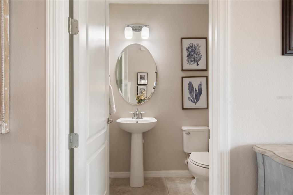 615 Timbervale Trail Clermont, FL 34715 - Photo 15 of 100 a bathroom with a toilet sink and mirror
