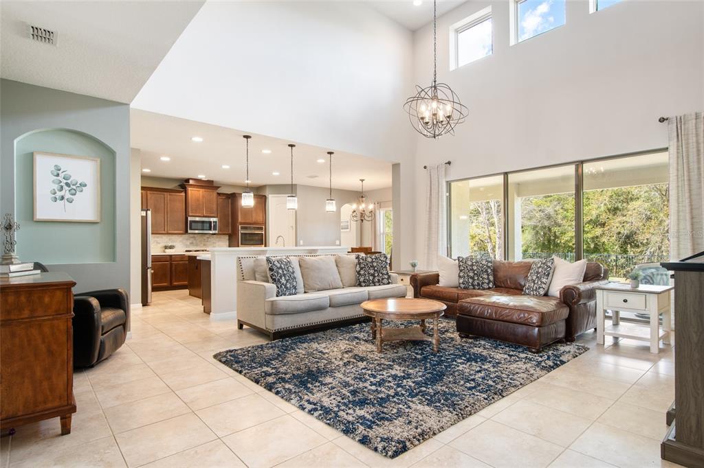 615 Timbervale Trail Clermont, FL 34715 - Photo 17 of 100 a living room with furniture and a large window