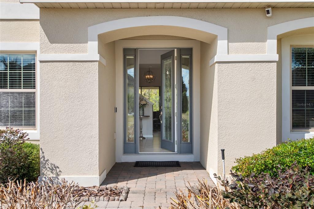 615 Timbervale Trail Clermont, FL 34715 - Photo 3 of 100 a view of a entrance door of the house