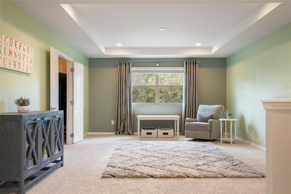 615 Timbervale Trail Clermont, FL 34715 - Photo 41 of 100 a bedroom with a bed and a couch