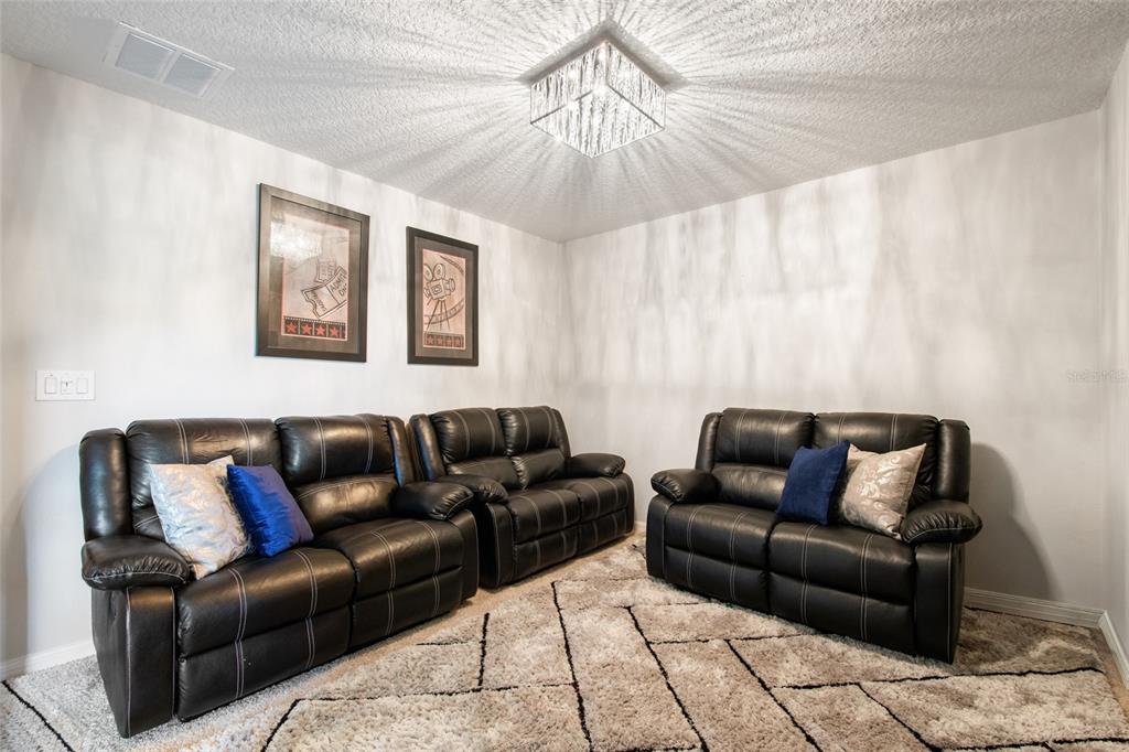 615 Timbervale Trail Clermont, FL 34715 - Photo 44 of 100 a living room with furniture and a couch