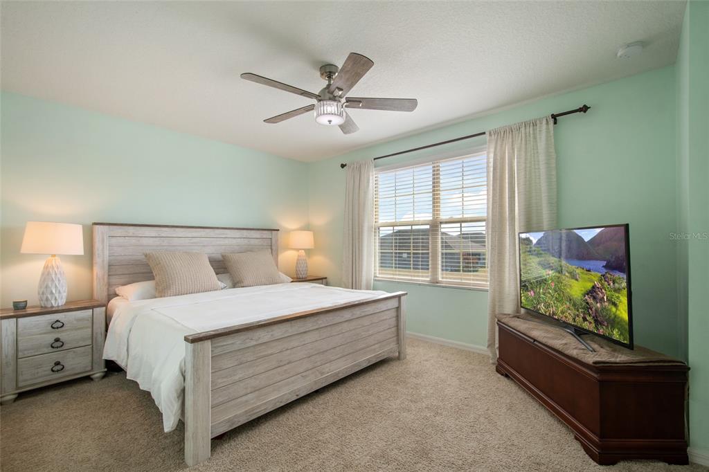 615 Timbervale Trail Clermont, FL 34715 - Photo 55 of 100 a bedroom with a bed and a window