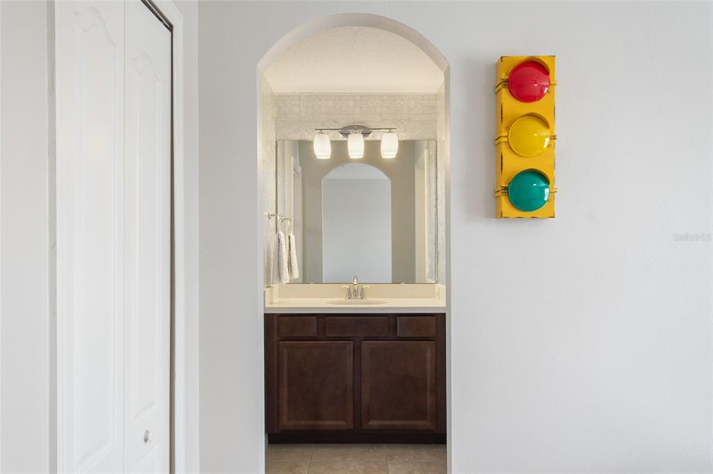 615 Timbervale Trail Clermont, FL 34715 - Photo 66 of 100 a close view of a bathroom sink and a mirror