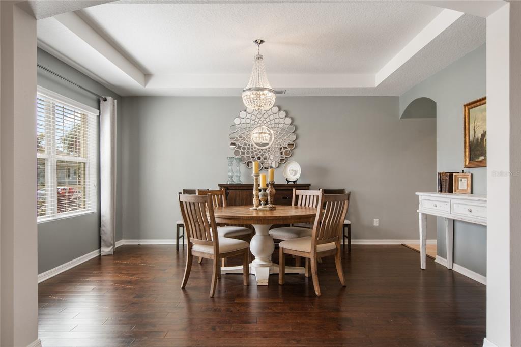 615 Timbervale Trail Clermont, FL 34715 - Photo 7 of 100 a view of a dining room with furniture window and wooden floor