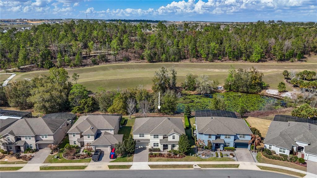 615 Timbervale Trail Clermont, FL 34715 - Photo 75 of 100 an aerial view of a house with garden space and outdoor seating