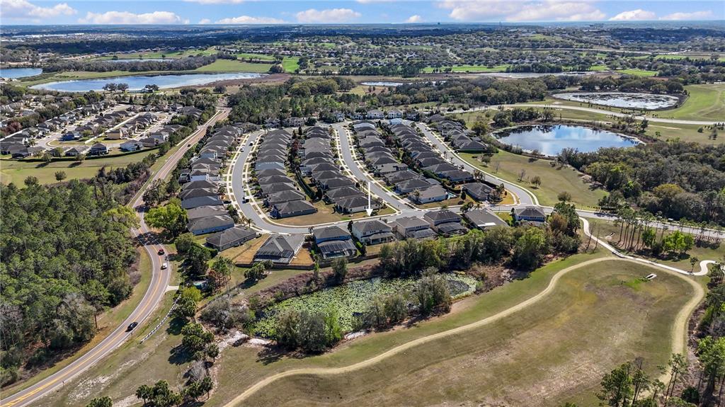 615 Timbervale Trail Clermont, FL 34715 - Photo 79 of 100 an aerial view of a city with lots of residential buildings