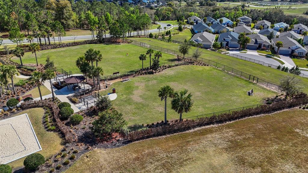 615 Timbervale Trail Clermont, FL 34715 - Photo 89 of 100 an aerial view of a house with a yard and lake view