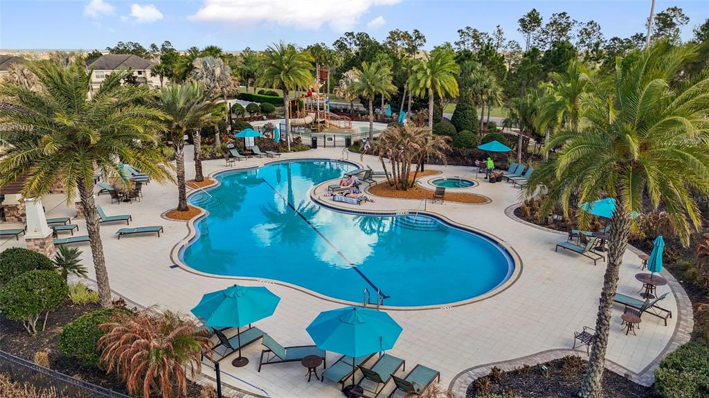 615 Timbervale Trail Clermont, FL 34715 - Photo 90 of 100 a view of a swimming pool with chairs