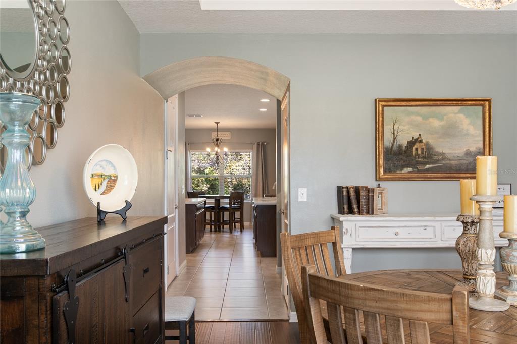 615 Timbervale Trail Clermont, FL 34715 - Photo 9 of 100 a view of a dining room with furniture and wooden floor