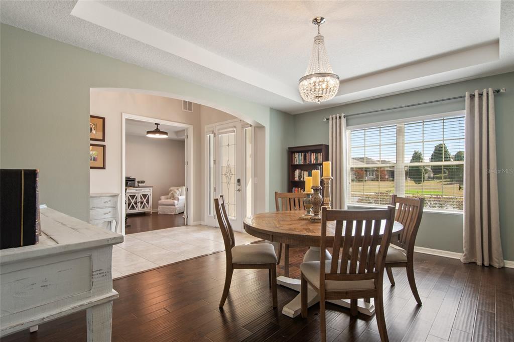 615 Timbervale Trail Clermont, FL 34715 - Photo 10 of 100 a view of a dining room with furniture window and wooden floor