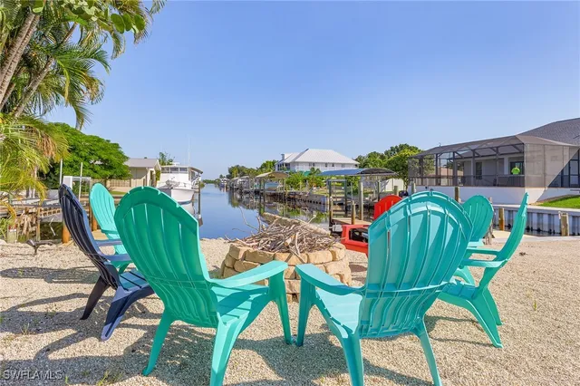 a view of a chairs and table in the patio