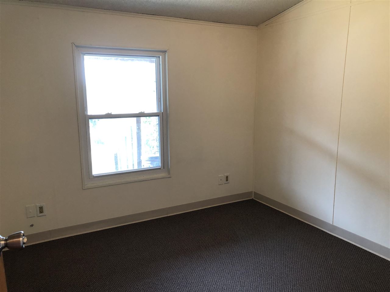 1676 Whitney Road Franklin Grove, IL 61031 - Photo 11 of 28 an empty room with a window