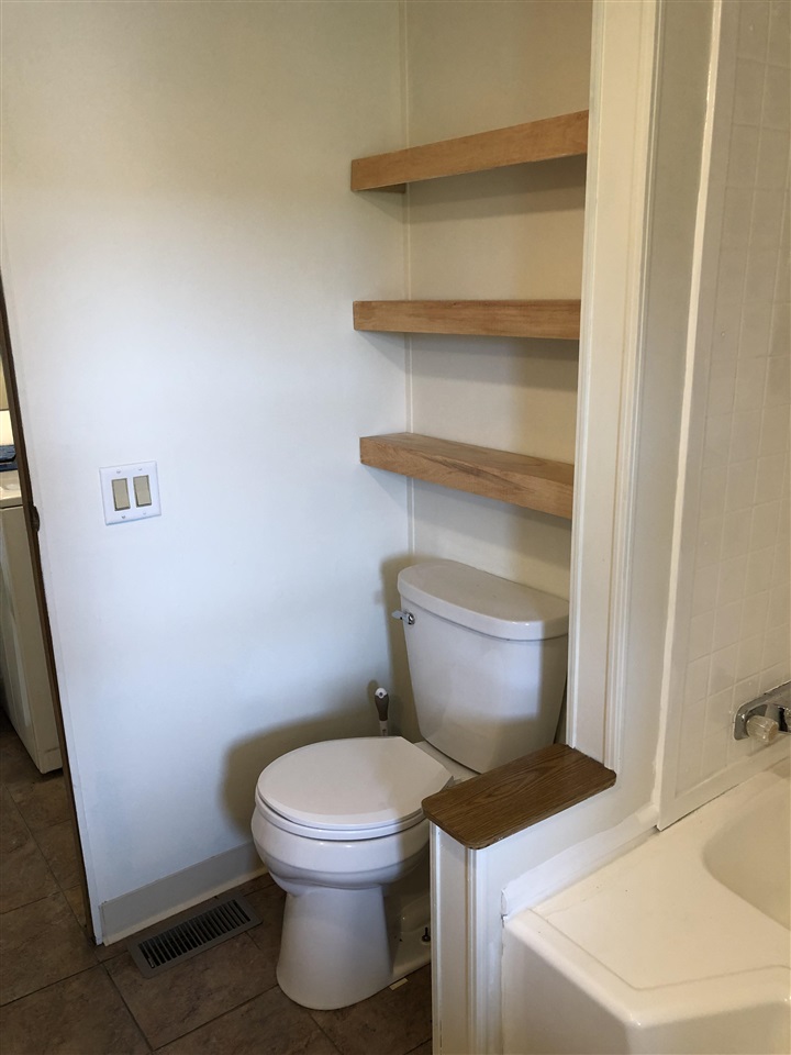 1676 Whitney Road Franklin Grove, IL 61031 - Photo 13 of 28 a bathroom with a toilet and a sink