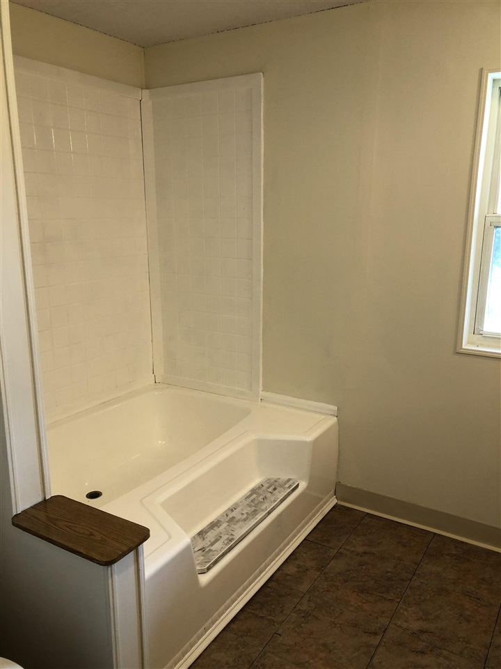 1676 Whitney Road Franklin Grove, IL 61031 - Photo 14 of 28 a room with a bed and a window