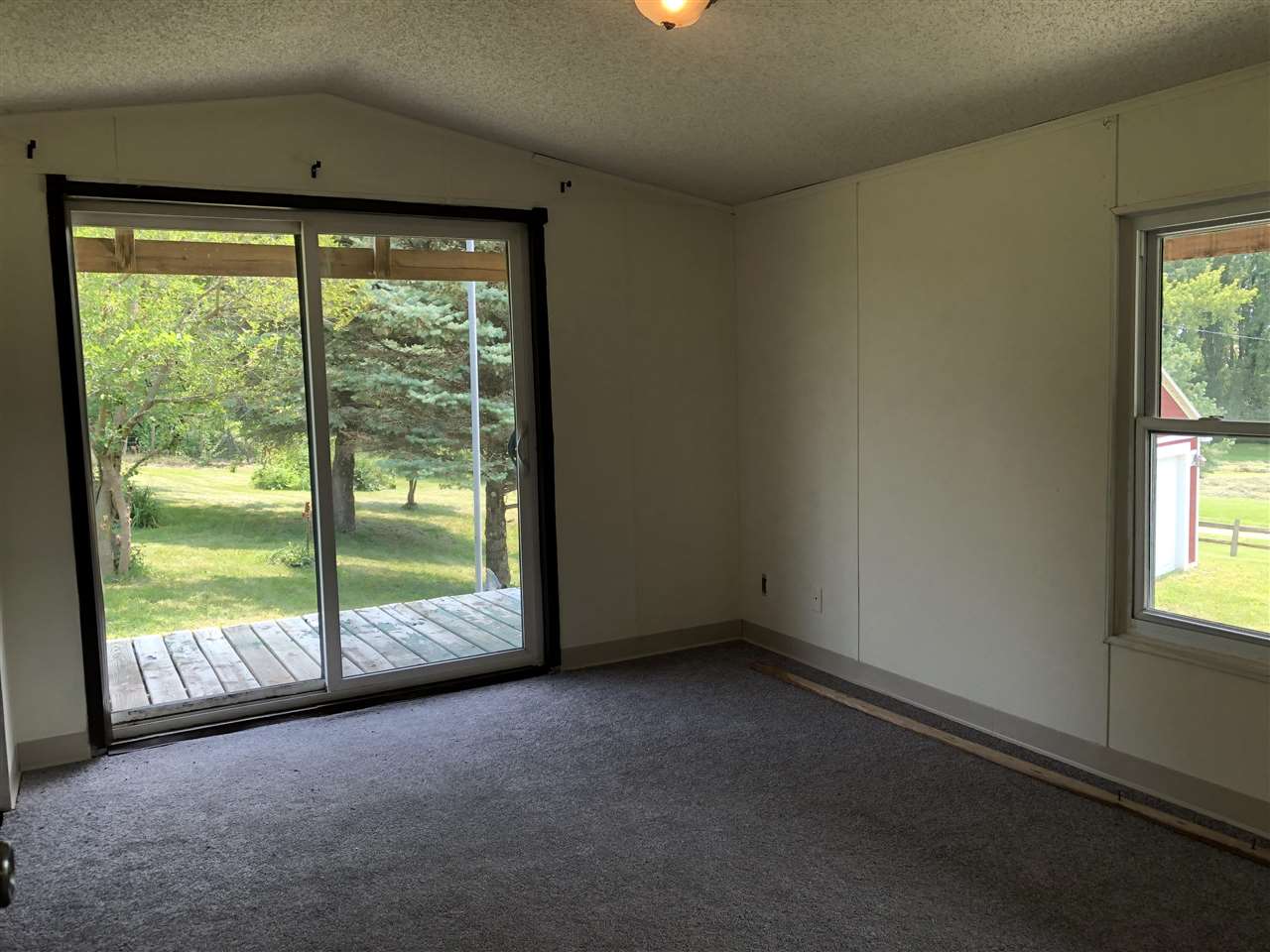1676 Whitney Road Franklin Grove, IL 61031 - Photo 17 of 28 a view of a room with a large window