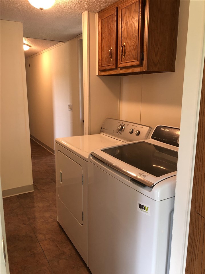 1676 Whitney Road Franklin Grove, IL 61031 - Photo 19 of 28 a utility room with washer and dryer