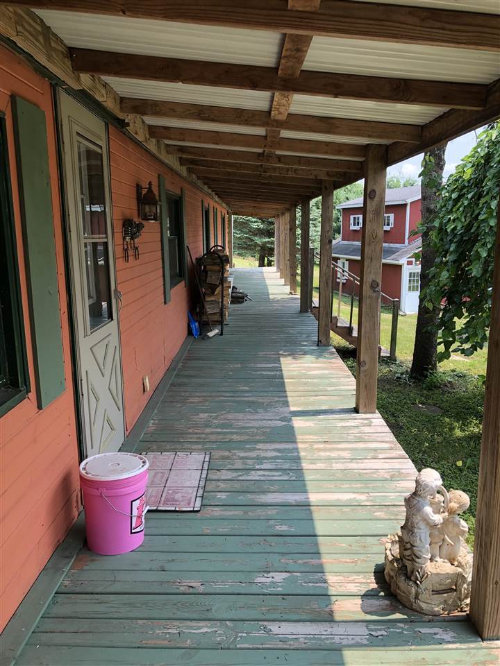 1676 Whitney Road Franklin Grove, IL 61031 - Photo 20 of 28 a view of a patio with a table and chairs