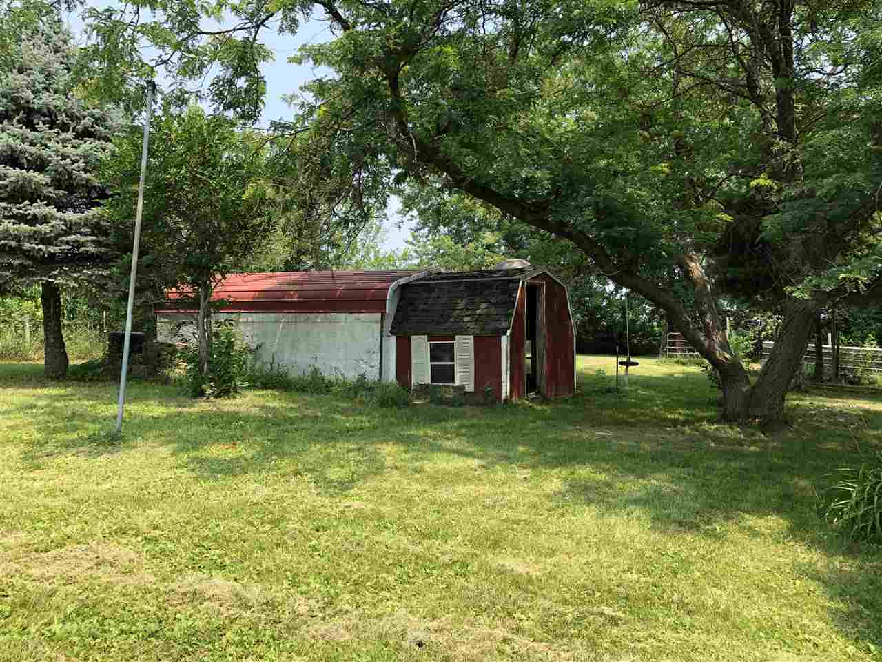 1676 Whitney Road Franklin Grove, IL 61031 - Photo 22 of 28 a view of a house with a backyard