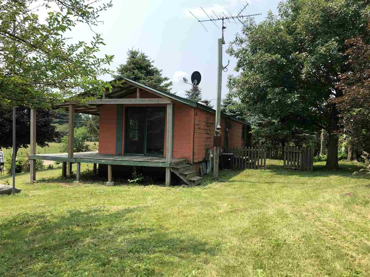 1676 Whitney Road Franklin Grove, IL 61031 - Photo 23 of 28 a view of a house with a yard and sitting area