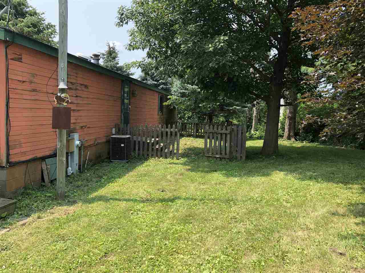 1676 Whitney Road Franklin Grove, IL 61031 - Photo 24 of 28 a backyard of a house with barbeque oven