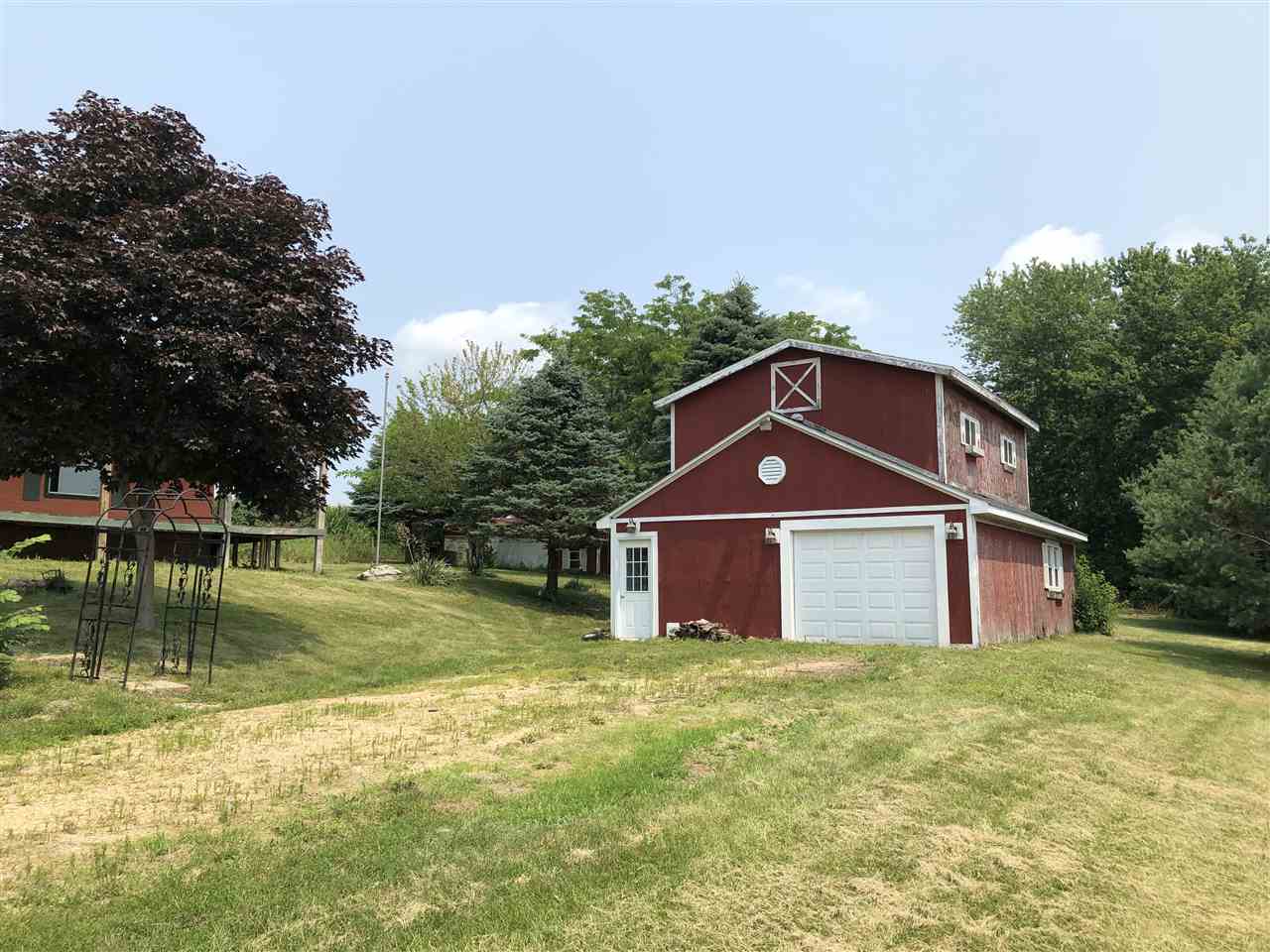 1676 Whitney Road Franklin Grove, IL 61031 - Photo 26 of 28 a front view of a house with a yard