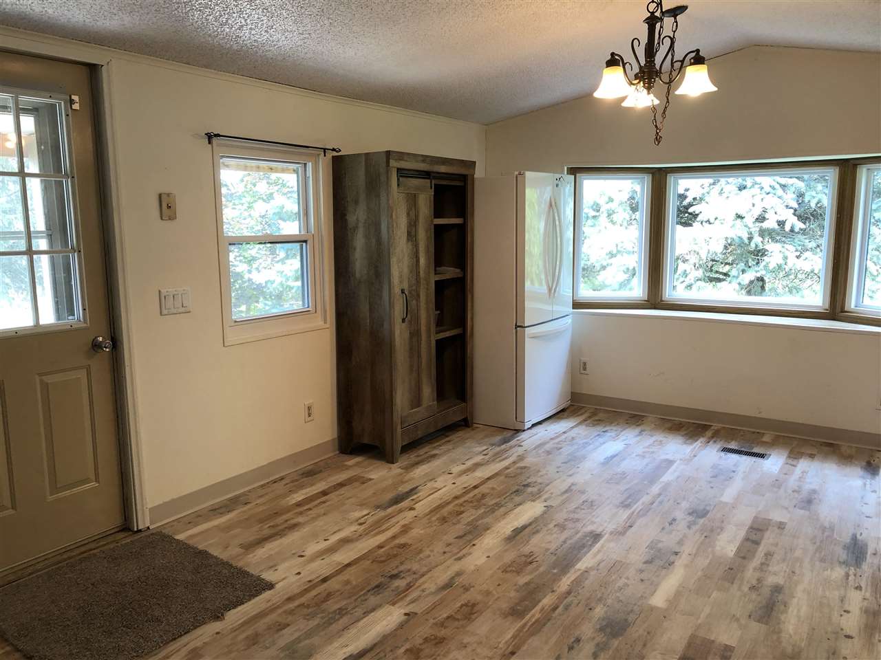 1676 Whitney Road Franklin Grove, IL 61031 - Photo 8 of 28 a view of an empty room with a window
