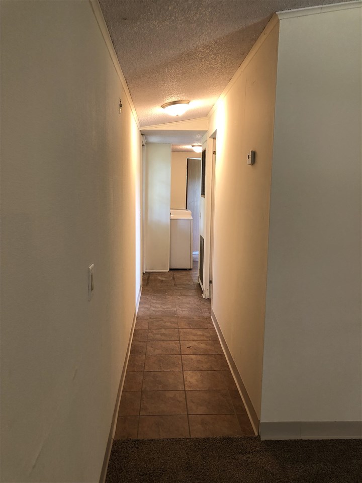 1676 Whitney Road Franklin Grove, IL 61031 - Photo 9 of 28 a view of a hallway with a wooden floor