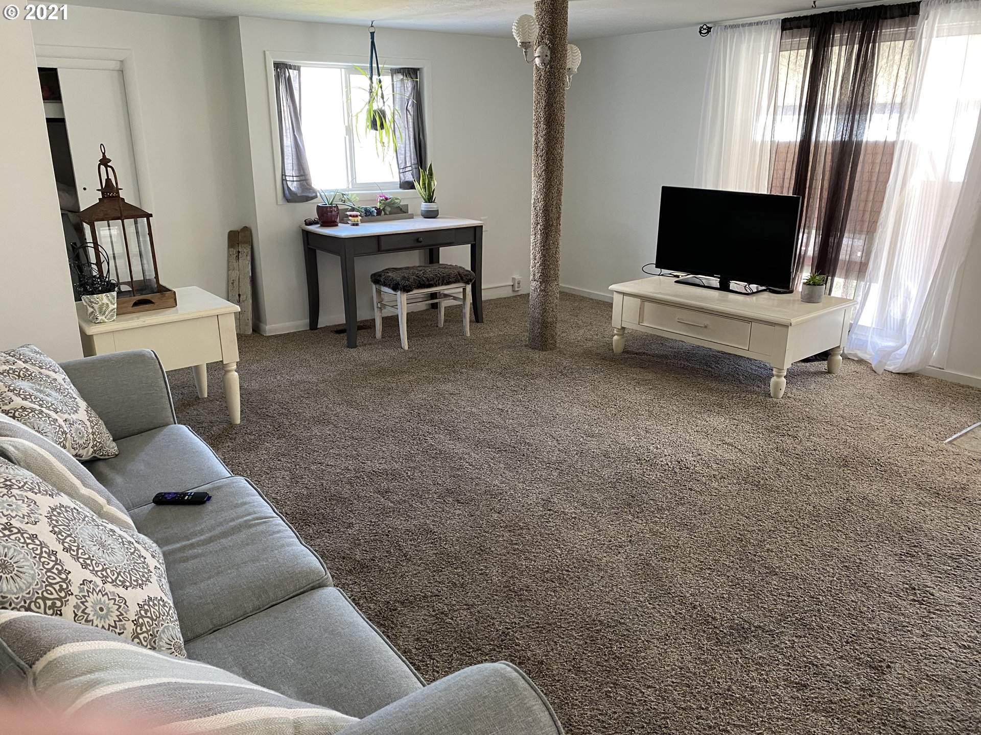 1515 Southwest Frazer Avenue Pendleton, OR 97801 - Photo 3 of 11 a living room with furniture and a flat screen tv