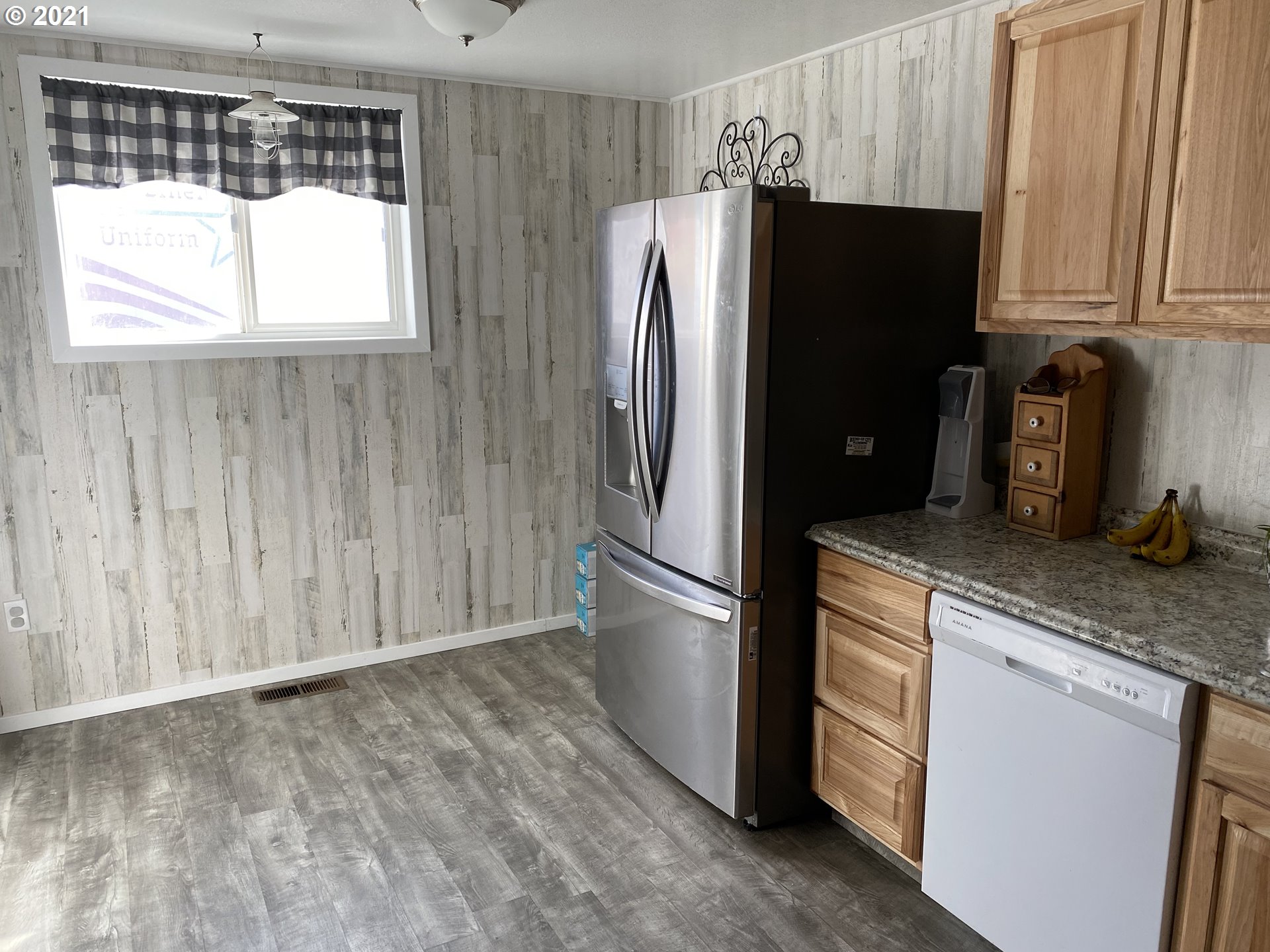 1515 Southwest Frazer Avenue Pendleton, OR 97801 - Photo 9 of 11 a kitchen with stainless steel appliances granite countertop a refrigerator and a stove