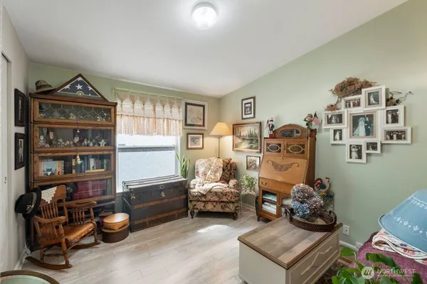 a bedroom with furniture and a baby crib