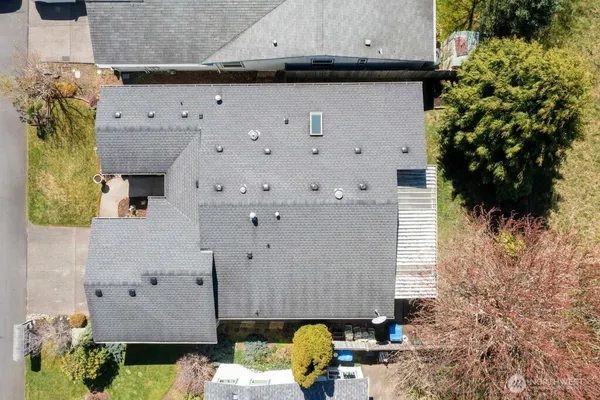 aerial view of a house with a yard