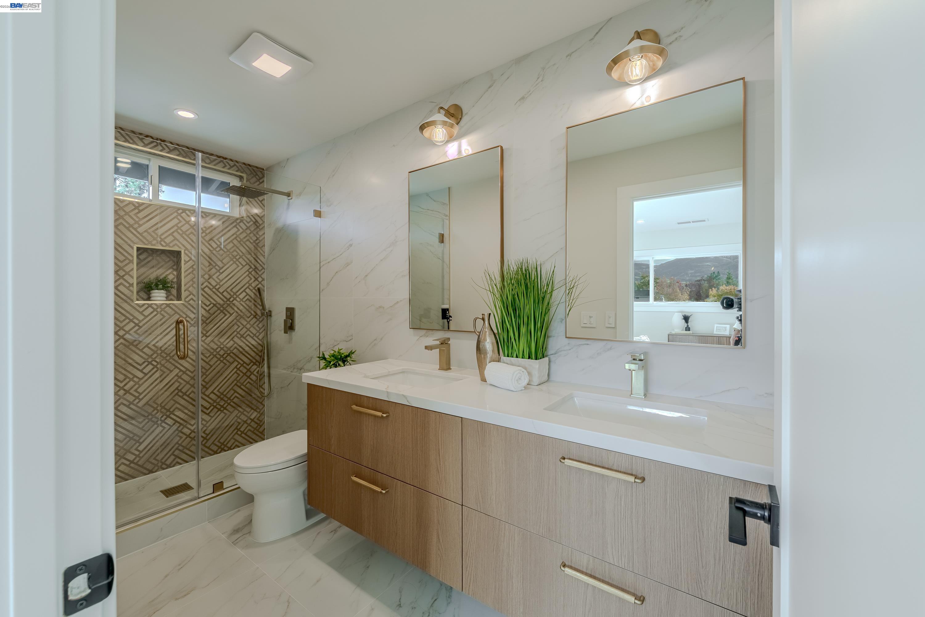 311 Foxboro Court San Ramon, CA 94583 - Photo 11 of 46 a bathroom with a sink a toilet and shower