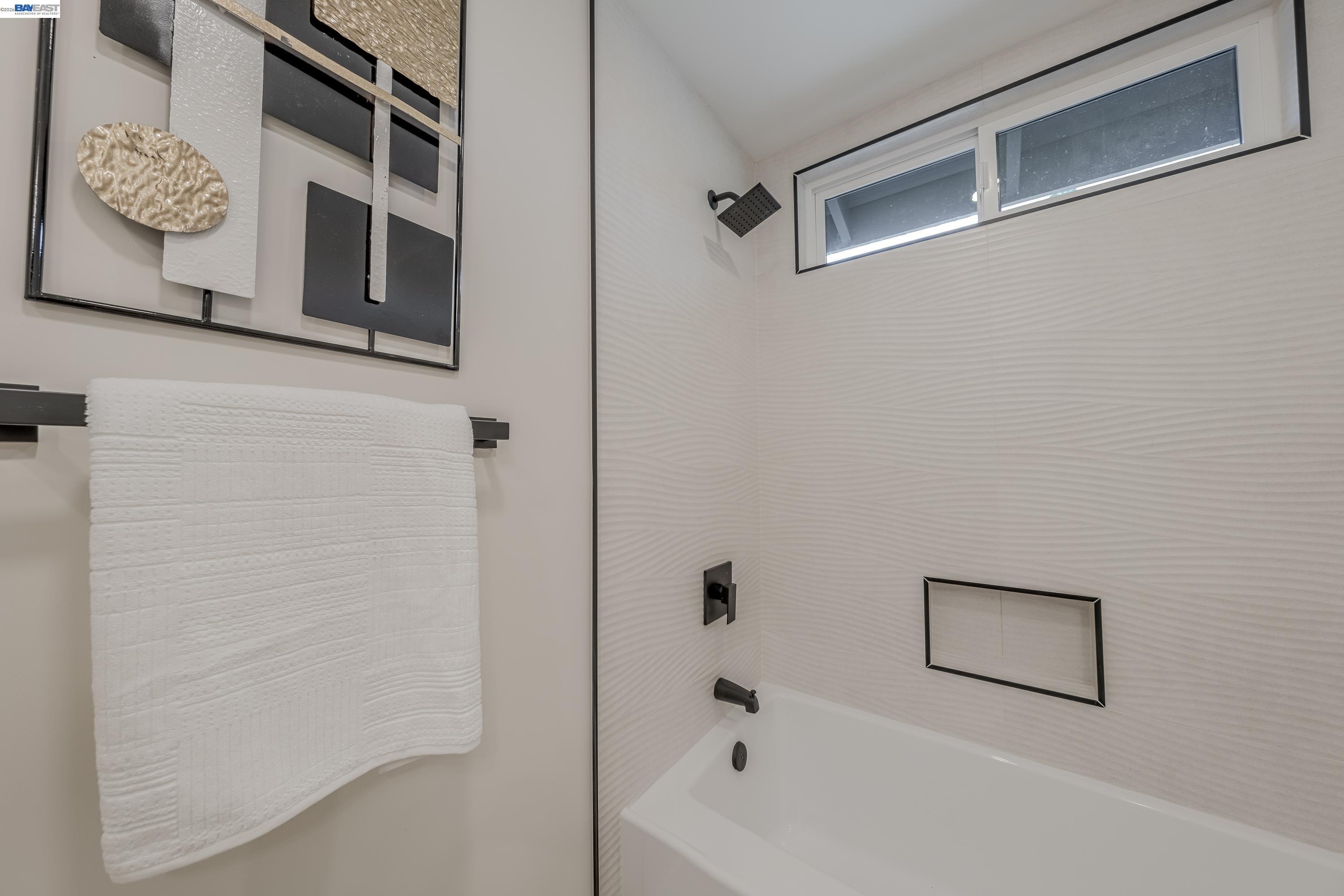 311 Foxboro Court San Ramon, CA 94583 - Photo 16 of 46 a bathroom with a bathtub and shower