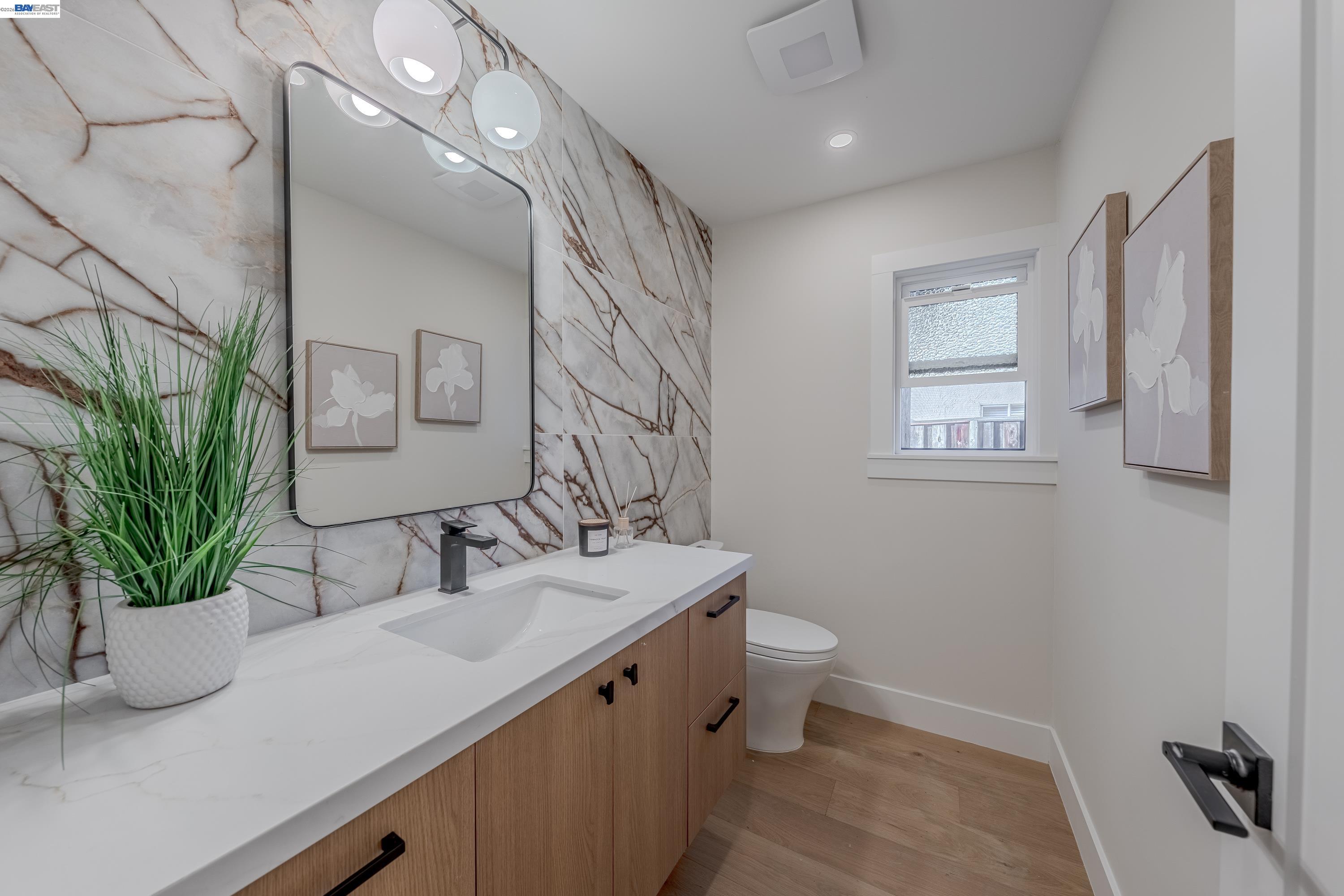 311 Foxboro Court San Ramon, CA 94583 - Photo 22 of 46 a bathroom with a sink a toilet and a mirror