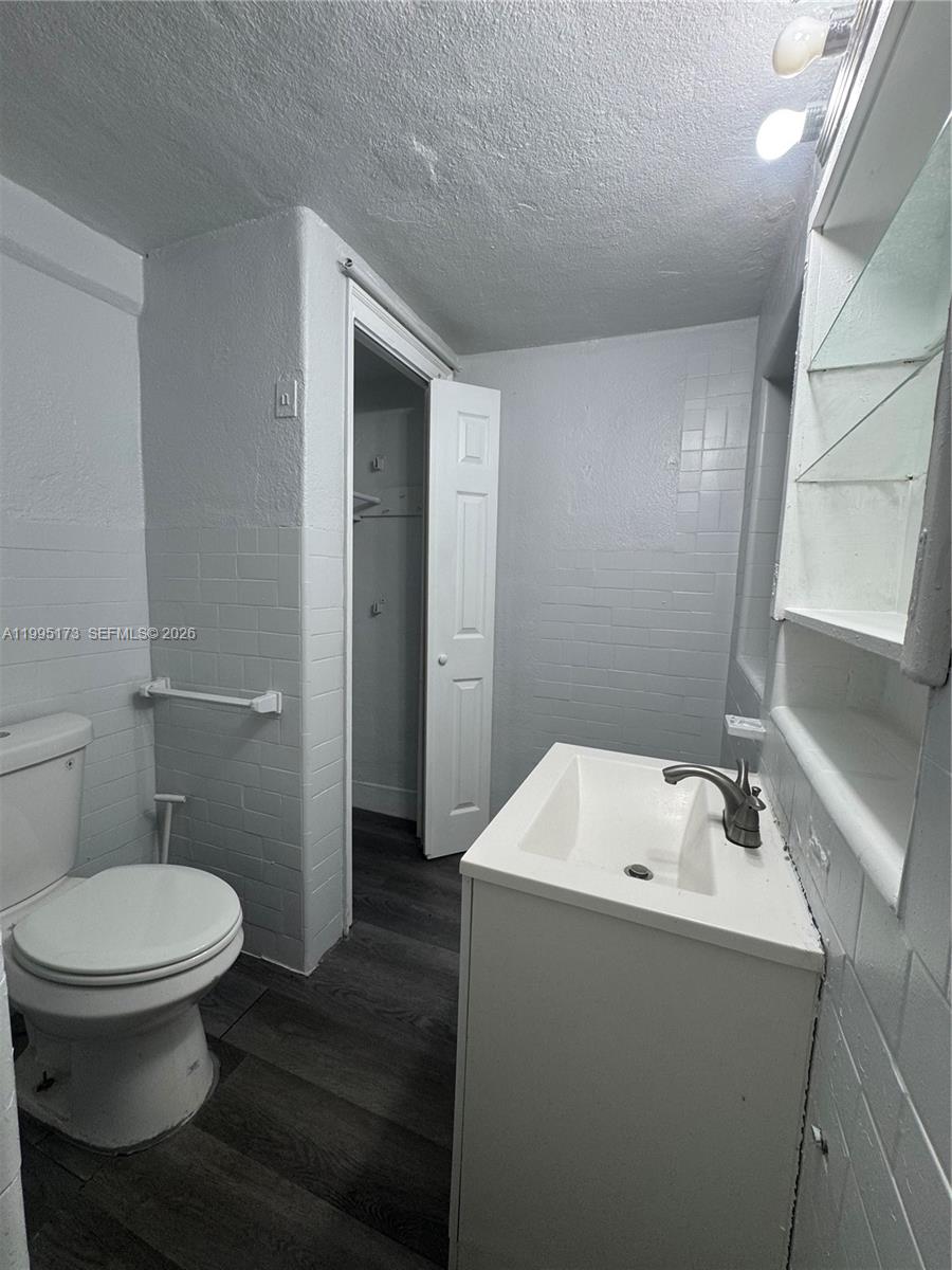 7802 Northwest 8th Avenue, Unit 4 Miami, FL 33150 - Photo 3 of 4 a bathroom with a sink toilet and shower